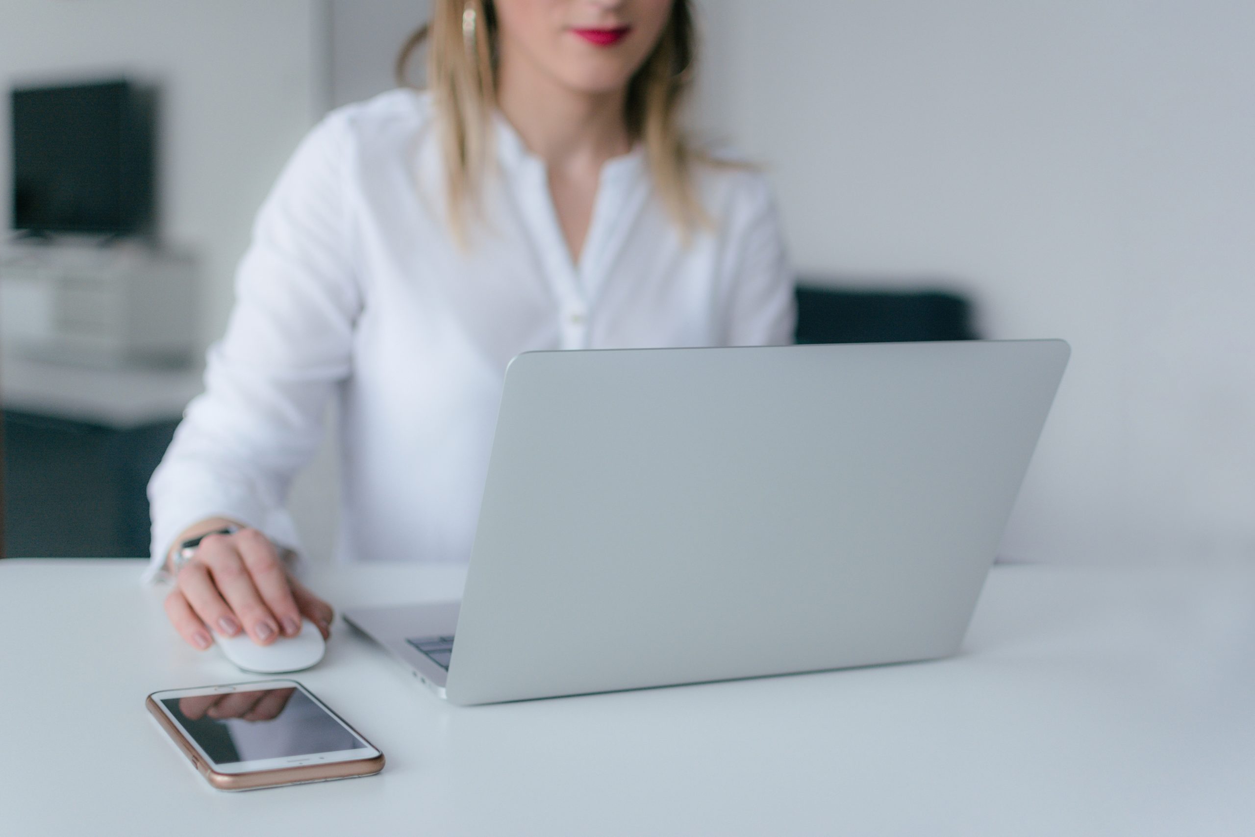 woman-using-silver-laptop-2265488