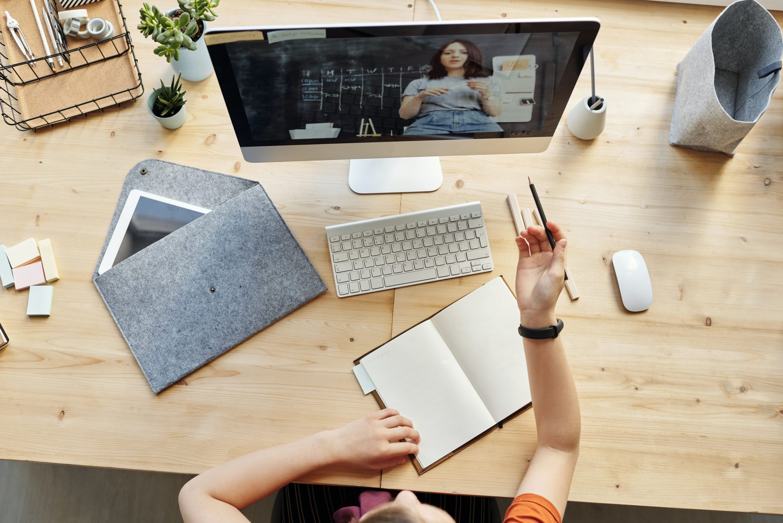 top-view-photo-of-girl-watching-through-imac-4144294